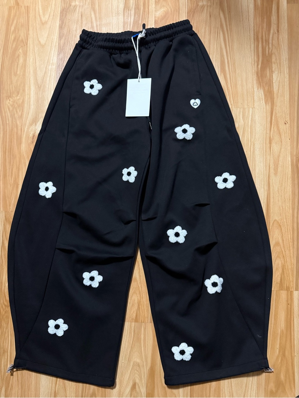 Aelfric Eden Black Sweatpants with White Floral Appliqués
